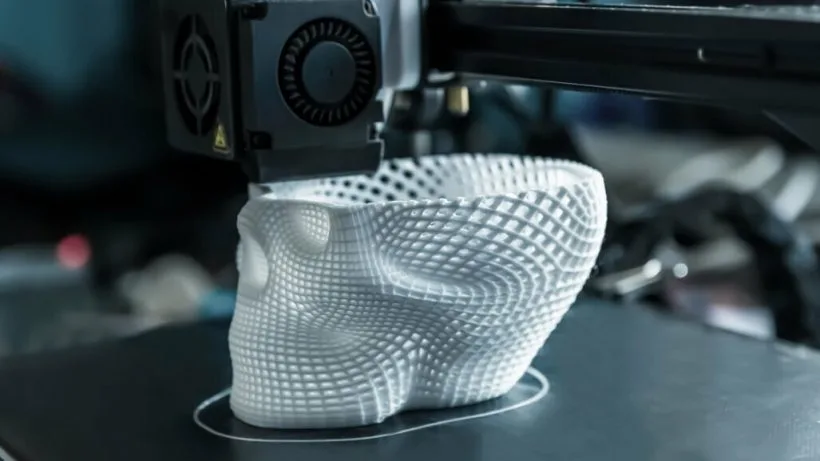 3D printer in process, creating a complex white object through additive manufacturing 3D printer in process, creating a complex white object through additive manufacturing