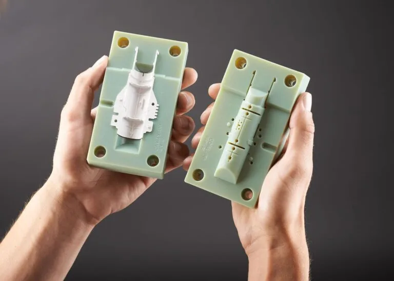 Advantages of using 3D printing for injection molding hands holding a prototype mold