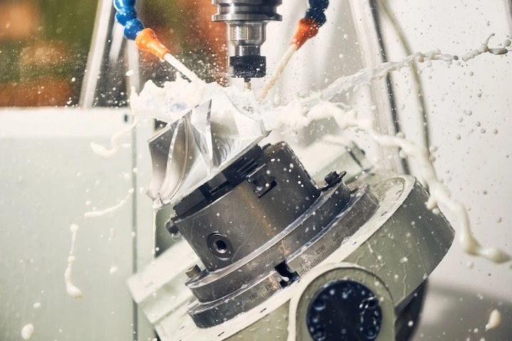 High speed coolant spray during precision milling operation High speed coolant spray during precision milling operation