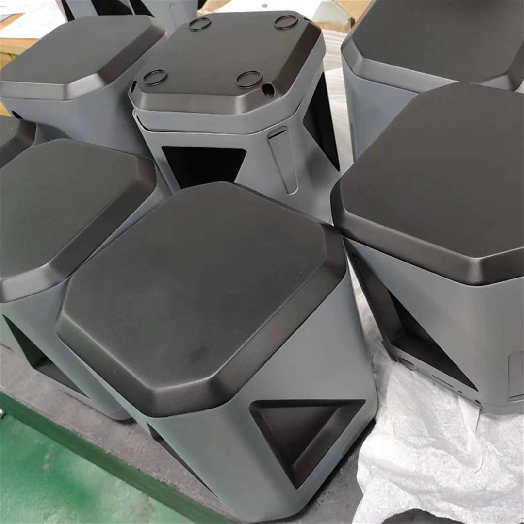 Injection molded black components in uniform batch Injection molded black components in uniform batch