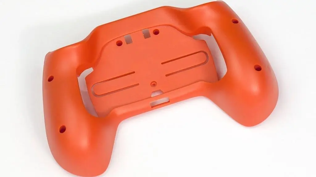 Orange plastic part manufactured using low volume injection molding Orange plastic part manufactured using low volume injection molding