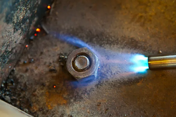 Using heat on a metal nut during the welding process Using heat on a metal nut during the welding process